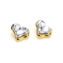 Load image into Gallery viewer, Two-tone heart ear jacket earrings with a polished silver heart replacing the traditional earring back, paired with a gold heart stud for a layered sculptural design.