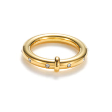 Load image into Gallery viewer, Gold band ring with white cubic zirconia stones, featuring a smooth polished finish and evenly spaced CZ details for a modern minimalist look.