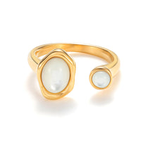 Load image into Gallery viewer, Gold adjustable open mother-of-pearl ring with sculptural band and luminous natural shell stones in a modern statement design.