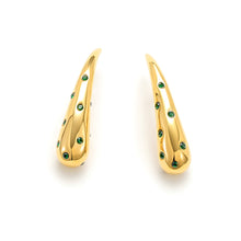 Load image into Gallery viewer, Pair of polished gold teardrop stud earrings with emerald green cubic zirconia accents in a modern sculptural design.