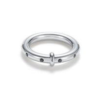 Load image into Gallery viewer, Silver band ring with black cubic zirconia stones, designed with a sleek rounded profile and subtle CZ accents for a modern, minimalist style.
