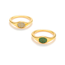 Load image into Gallery viewer, Gold oval signet ring with emerald cubic zirconia stones, polished sculptural finish.
Gold oval signet ring with white cubic zirconia stones, modern minimalist design

