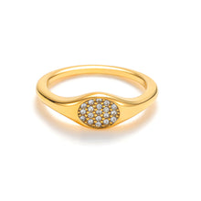 Load image into Gallery viewer, Gold oval signet ring with white cubic zirconia stones, modern minimalist design

