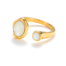 Load image into Gallery viewer, Gold adjustable open mother-of-pearl ring with sculptural band and luminous natural shell stones in a modern statement design.
