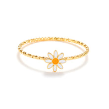 Load image into Gallery viewer, Gold enamel daisy ring with white petals and yellow center on a textured gold band, delicate minimalist floral jewelry.
