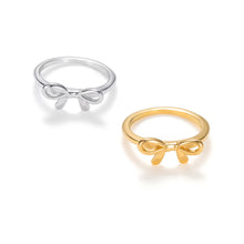 Load image into Gallery viewer, Minimalist gold bow ring with delicate ribbon knot design and polished band. Minimalist silver bow ring featuring a delicate ribbon bow design on a slim band.
