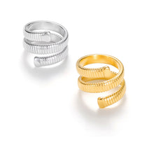 Load image into Gallery viewer, Gold spiral coil wrap ring with ribbed serpentine band and sculptural modern design. Silver spiral coil wrap ring with ribbed serpentine band and modern sculptural design.
