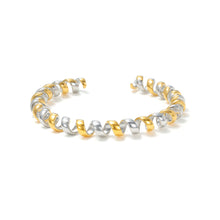 Load image into Gallery viewer, Two-Tone Twisted Ribbon Open Cuff Bracelet with a modern coiled ribbon design, blending polished gold and silver tones for a contemporary statement look.
