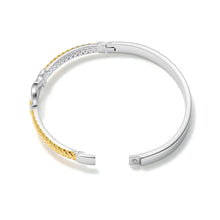 Load image into Gallery viewer, Back view of the Two-Tone Equestrian Buckle Hinged Bangle Bracelet showcasing the secure hinged closure, polished interior, and mixed metal design.
