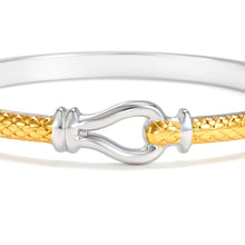 Load image into Gallery viewer, Close-up of the Two-Tone Equestrian Buckle Hinged Bangle Bracelet featuring a polished buckle clasp and textured mixed metal band with elegant detailing.
