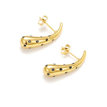Load image into Gallery viewer, Polished gold curved stud earrings with black cubic zirconia accents and butterfly backs displayed from the side.
