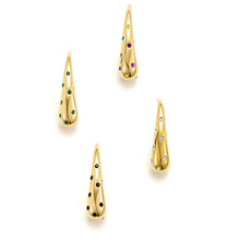 Load image into Gallery viewer, Gold sculptural teardrop stud earrings featuring colorful, clear, green, and black cubic zirconia accents on a light background.
